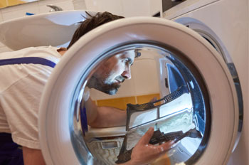 Technician look into the dryer